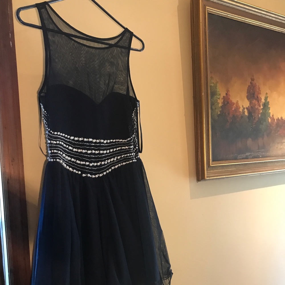 Worn once for homecoming. No other place to wear